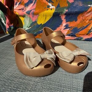 Mini Melissa Gold Dress Shoes with Bow